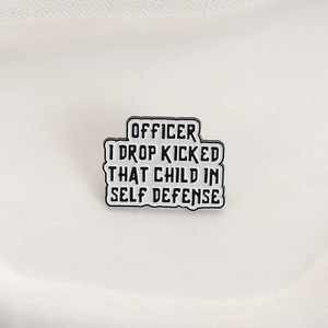 Funny metal enamel pin badge with black text Officer I Drop Kicked That Child In Self Defense