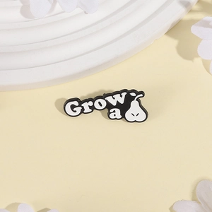 Creative enamel pear brooch with Grow a text in black and white minimalist metal design