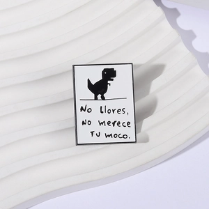 Minimalist rectangle enamel pin with black dinosaur silhouette and Spanish funny text