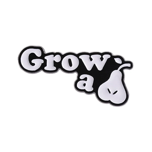 Cartoon pear enamel brooch with Grow a pair pun lettering in black and white finish