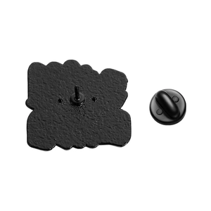 Back view of black metal badge featuring matte texture, fixing pin and rubber clutch