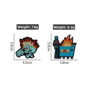 Detail view of funny skeleton enamel pins with size and weight labels on white background
