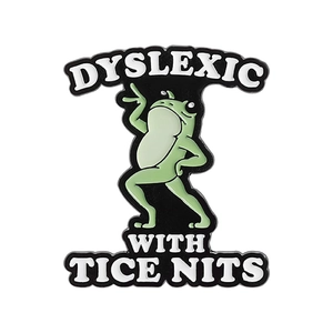 Funny cartoon frog enamel pin with DYSLEXIC WITH TICE NITS quote on black badge