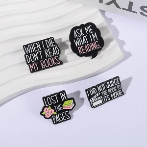 Minimalist enamel book pins set featuring reading quotes and creative badge designs