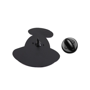 Detail of the black enamel UFO cat brooch back showing alloy pin and rubber clasp