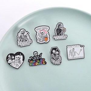 Set of 7 punk style skull enamel pins featuring funny slogans and unique gothic designs