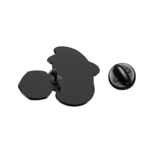 Detail of black cat enamel pin back showing the metal clutch and rubber butterfly clasp