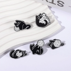 Cute black cat enamel pins set featuring D20 dice and Chomp design for board game lovers