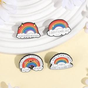 Rainbow and cloud enamel pin set with witty English slogans on a stylish display board
