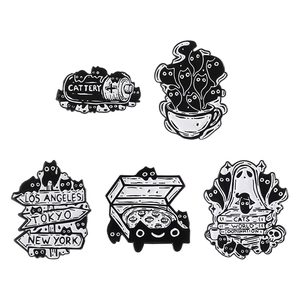 Set of 5 cute black and white cat enamel pins with city names and creative motifs
