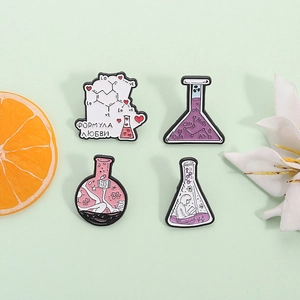 Cute chemistry set of four lab beaker enamel pins in pink and purple for science lovers