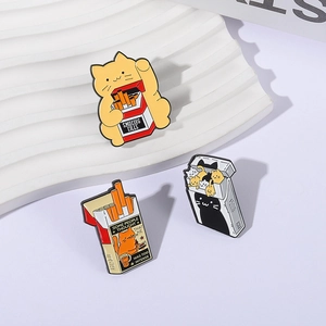 Whimsical enamel cat and cigarette box brooch set with vibrant cartoon character designs