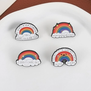 Funny rainbow and cloud enamel pin set with sarcastic quotes on a white tray