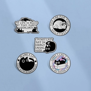 Set of 5 minimalist black cat enamel pins with humorous quotes on light blue background