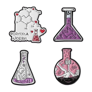 Set of four chemistry enamel pins featuring science flasks and DNA atoms on white background