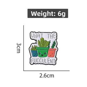 Macro detail of cartoon plant enamel pin badge showing dimensions 3cm height and 2.6cm width