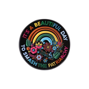Round enamel pin with rainbow and flowers, text It's a Beautiful Day to Smash the Patriarchy