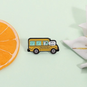 Creative yellow struggle bus enamel pin with cartoon goose drivers on green background