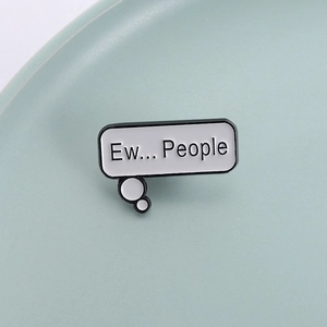 Creative bubble badge enamel pin with Ew People text design in a ceramic tray