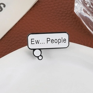 Minimalist metal enamel pin featuring Ew... People speech bubble design on a white ceramic plate