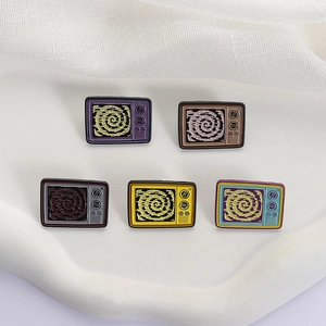 Set of five vintage colorful enamel television brooches with spiral retro screen texture
