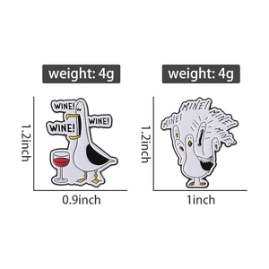 Detail view of funny seagull enamel pins featuring Wine and Mine text slogans