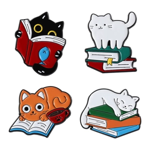 Set of four cute cartoon cat and book enamel pins made of colorful zinc alloy