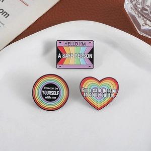 Rainbow LGBT enamel pins set featuring heart and round shapes with a safe person quote