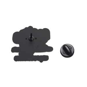Detail view of black enamel brooch back with secure rubber clutch and anti-rotation pin