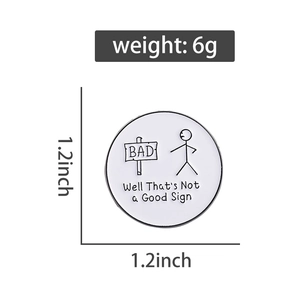 Detail view of 1.2 inch round enamel badge with bad sign stickman design and 6g weight