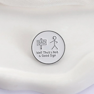 Round metal enamel pin featuring a stickman and 'Well That's Not a Good Sign' text