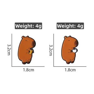 Detailed view of two cute Capybara enamel pins with size markings 3.2cm by 1.8cm