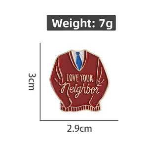 Detail view of MISTER ROGERS red sweater enamel pin showing 3cm x 2.9cm dimensions