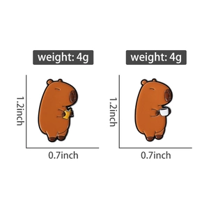 Macro view of Capybara enamel pins showing dimensions and weights of the cute animal badges