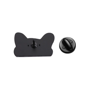 Detail view of the black alloy cat head enamel pin back with rubber butterfly clutch