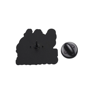 Detail view of cartoon goose enamel pin back with matte texture and black rubber clutch