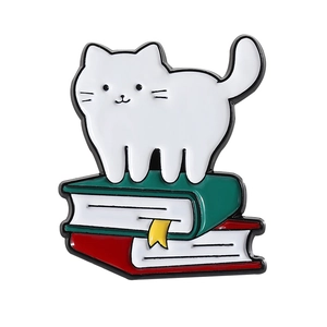 Cute white cat standing on colorful books enamel pin badge with vibrant metal finish