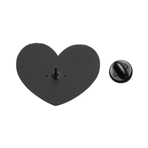 Detail view of pink heart brooch back showing the metal pin and black rubber clutch