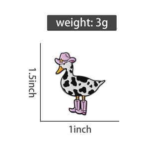 Detail of cowboy duck enamel pin showing 1.5-inch height and weight of 3 grams