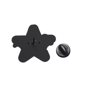 Detailed view of black metal star pin back with rubber clutch on a white background