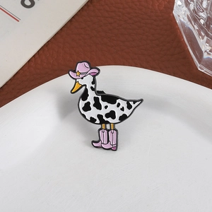 Cool cowboy duck enamel pin with cow print patterns and pink hat for fashion accessories