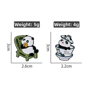 Detailed view of panda enamel pins with dimensions and weights on white background