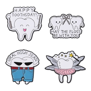 Set of 4 cute cartoon tooth enamel pins including dental floss and tooth fairy designs