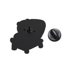 Detail view of the alloy brooch back with black matte coating and rubber pin back