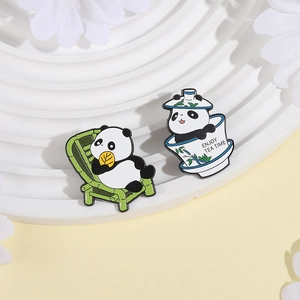 Cute panda enamel pins set featuring a panda eating bamboo and sitting in a teacup
