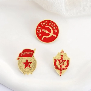Detailed macro view of Soviet-themed enamel pins featuring KGB shield and Eat the Rich design
