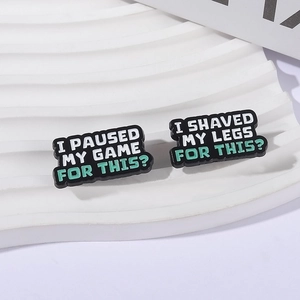 Funny enamel pin set featuring I PAUSED MY GAME and I SHAVED MY LEGS FOR THIS phrases