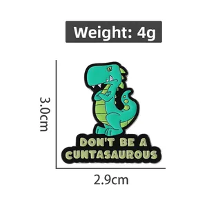 Macro shot of cartoon dinosaur enamel pin showing size 3.0x2.9cm and 4g weight