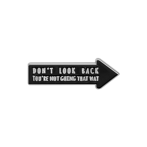 Arrow-shaped black enamel brooch with inspirational white text and silver metal edges