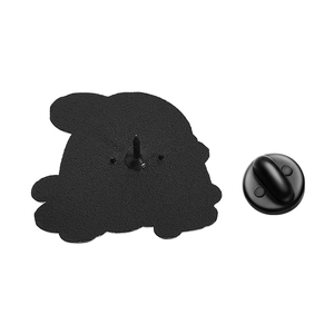Close-up of matte black metal enamel pin back and secure rubber clutch closure
